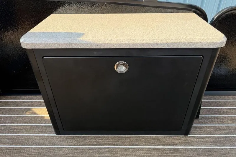 Slide: The Image of Black storage cabinet with beige countertop on Premier 250 Solaris RF -CL, 2026 model. - 26