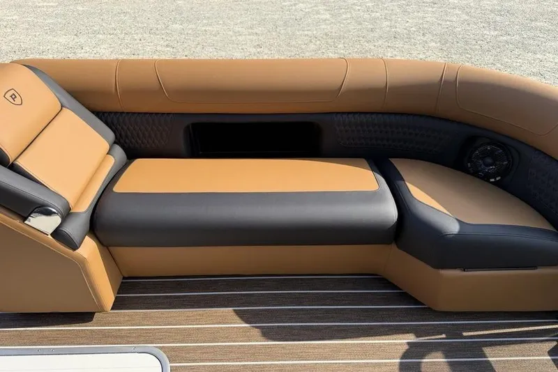 Slide: The Image of Luxurious seating on 2026 Premier 250 Solaris RF-CL boat, featuring tan and black upholstery. - 7