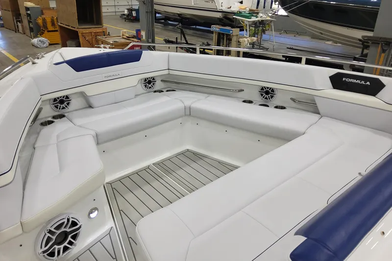 Slide: The Image of 2026 Formula 430 Super Sport Crossover boat interior with white seating and modern design. - 11