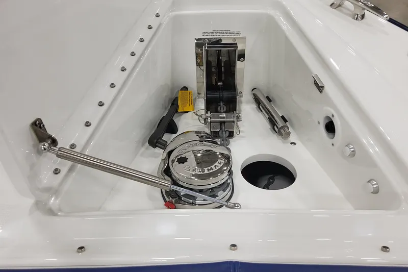 Slide: The Image of 2026 Formula 430 Super Sport Crossover anchor compartment with winch and stainless steel fittings. - 12