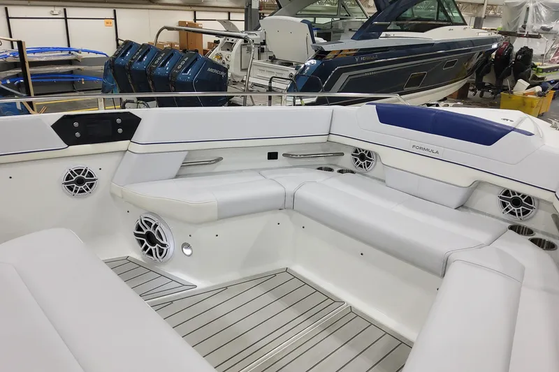 Slide: The Image of 2026 Formula 430 Super Sport Crossover boat interior with white seating and modern design. - 13