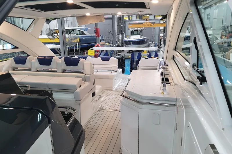 Slide: The Image of 2026 Formula 430 Super Sport Crossover luxury yacht interior with sleek seating and modern amenities. - 18