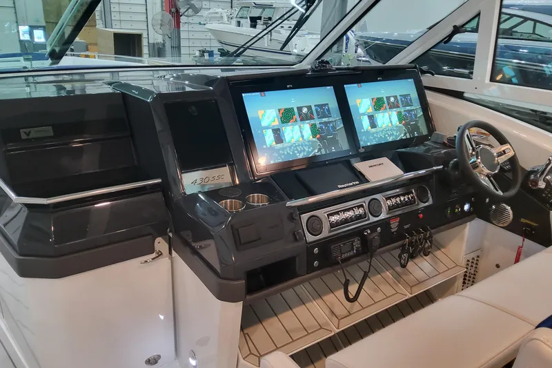 Slide: The Image of Helm of 2026 Formula 430 Super Sport Crossover with dual screens and modern controls. - 19