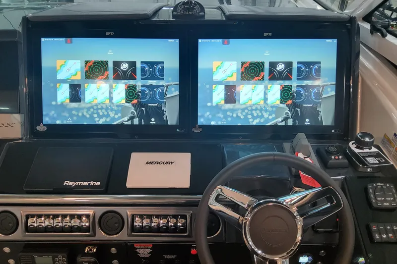 Slide: The Image of Helm of 2026 Formula 430 Super Sport Crossover with dual Raymarine displays and Mercury controls. - 23