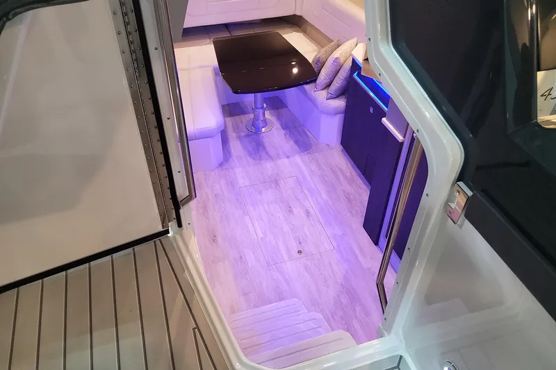 Slide: The Image of Interior view of 2026 Formula 430 Super Sport Crossover with modern seating and ambient lighting. - 31