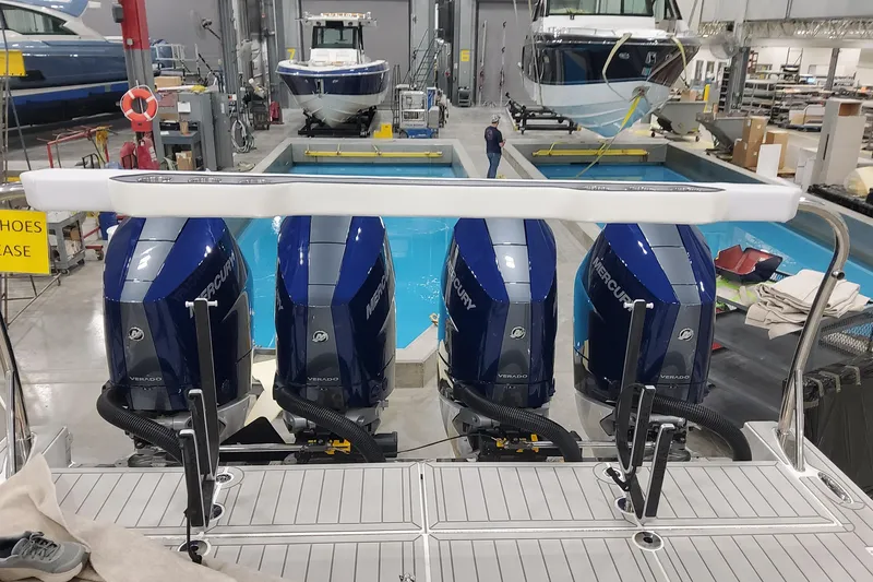 Slide: The Image of 2026 Formula 430 Super Sport Crossover with four Mercury Verado engines in a boatyard. - 40