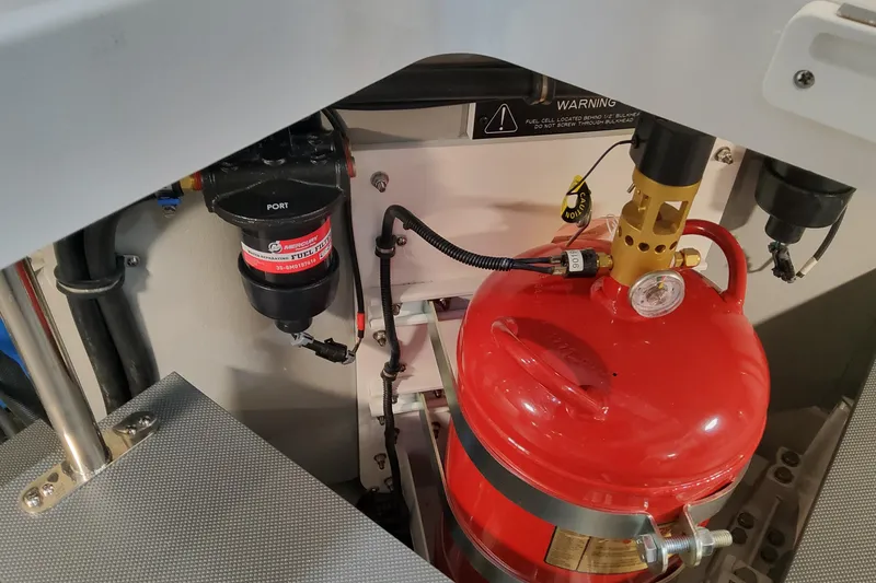 Slide: The Image of Engine compartment of 2026 Formula 430 Super Sport Crossover with fuel filter and fire extinguisher. - 48