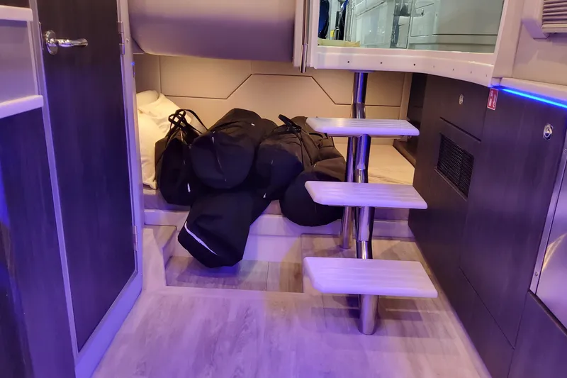 Slide: The Image of Interior of 2026 Formula 430 Super Sport Crossover with modern stairs and storage bags. - 50