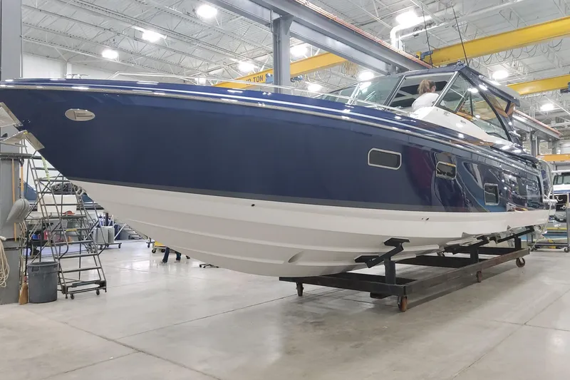 Slide: The Image of 2026 Formula 430 Super Sport Crossover yacht in a workshop setting. - 7