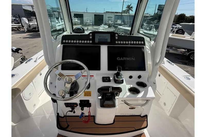 Slide: The Image of 2020 Everglades 273 Center Console boat dashboard with Garmin navigation system. - 20