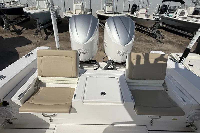 Slide: The Image of 2020 Everglades 273 Center Console boat with Yamaha 300 engines, docked with other boats. - 28