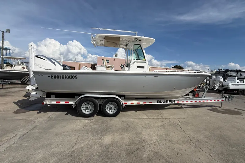 Slide: The Image of 2020 Everglades 273 Center Console boat on trailer under blue sky. - 5
