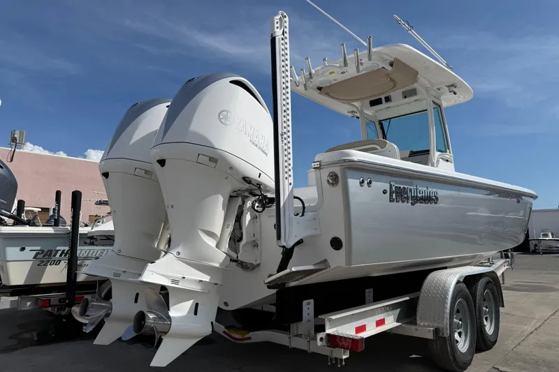 Slide: The Image of 2020 Everglades 273 Center Console boat with twin Yamaha engines on a trailer. - 6