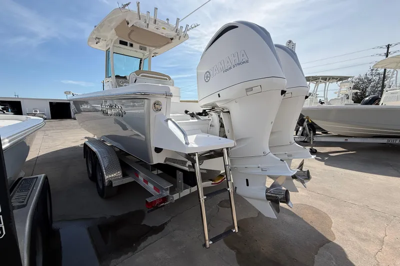 Slide: The Image of 2020 Everglades 273 Center Console boat with dual Yamaha engines on a trailer. - 8