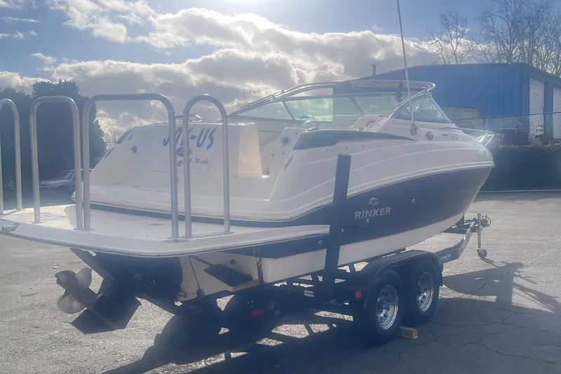Slide: The Image of 2007 Rinker 230 Captiva Atlantic boat on trailer under cloudy sky. - 10