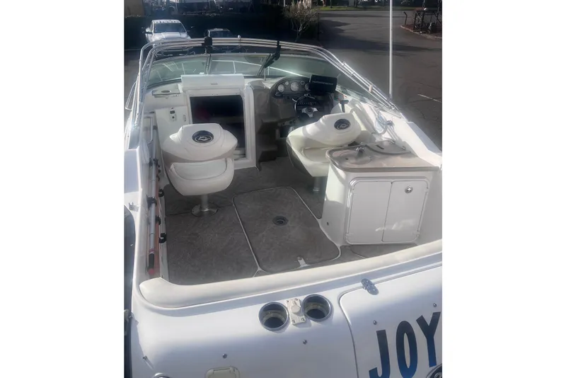Slide: The Image of 2007 Rinker 230 Captiva Atlantic boat interior with seating and dashboard view. - 13