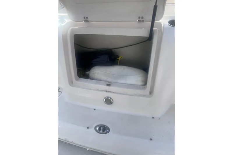 Slide: The Image of Open storage compartment on a 2007 Rinker 230 Captiva Atlantic boat. - 14