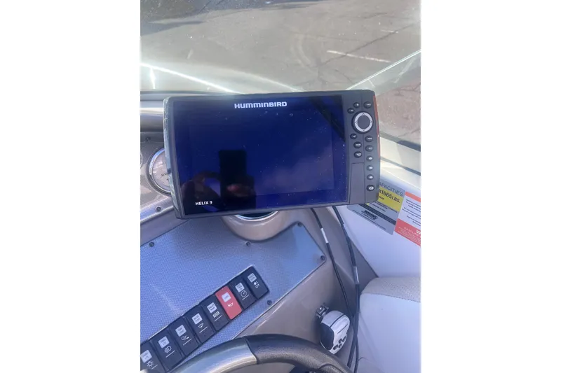 Slide: The Image of Dashboard of a 2007 Rinker 230 Captiva Atlantic with Humminbird Helix 9 display. - 21