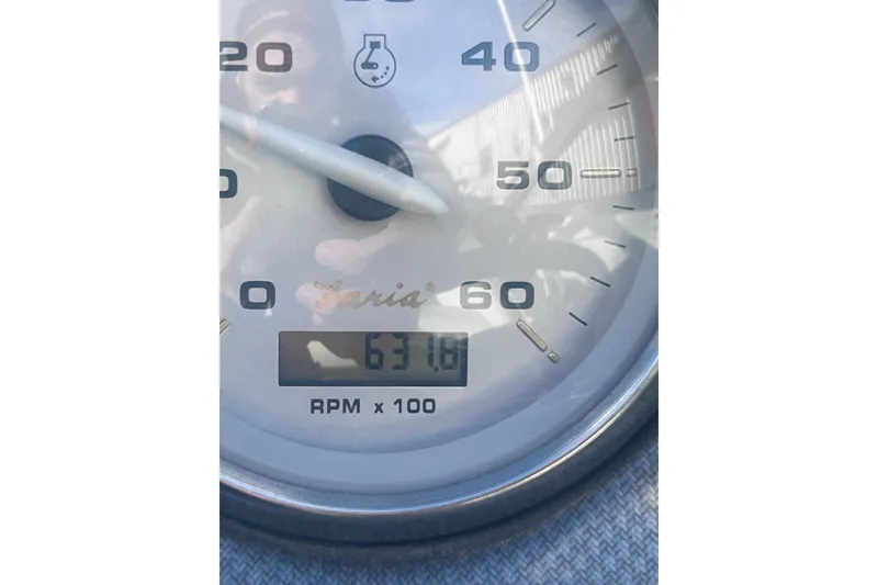 Slide: The Image of Close-up of a 2007 Rinker 230 Captiva Atlantic tachometer showing 631.6 RPM x 100. - 23