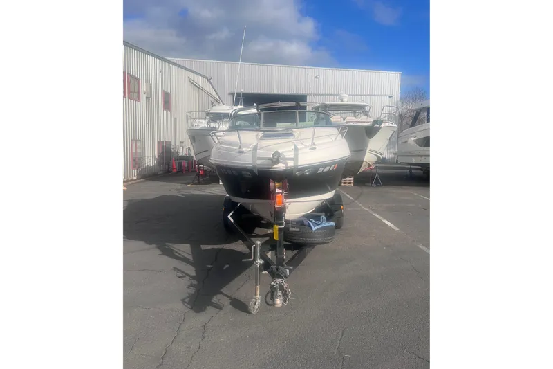 Slide: The Image of 2007 Rinker 230 Captiva Atlantic boat on trailer in parking lot. - 3