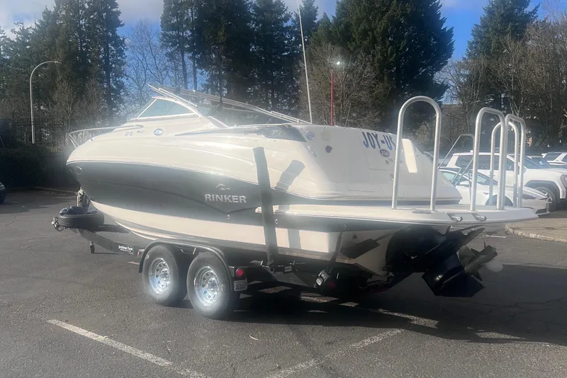 Slide: The Image of 2007 Rinker 230 Captiva Atlantic boat on trailer in parking lot. - 8