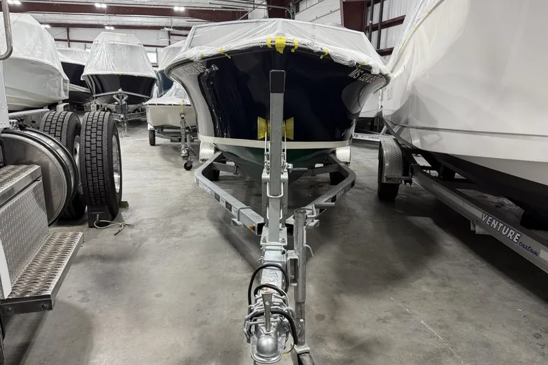 Slide: The Image of 2022 Rossiter 17 Closed Deck boat on trailer in storage facility. - 8