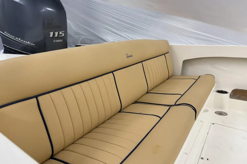 Slide: The Image of 2022 Rossiter 17 Closed Deck boat interior with tan seating and Yamaha 115 outboard motor. - 9