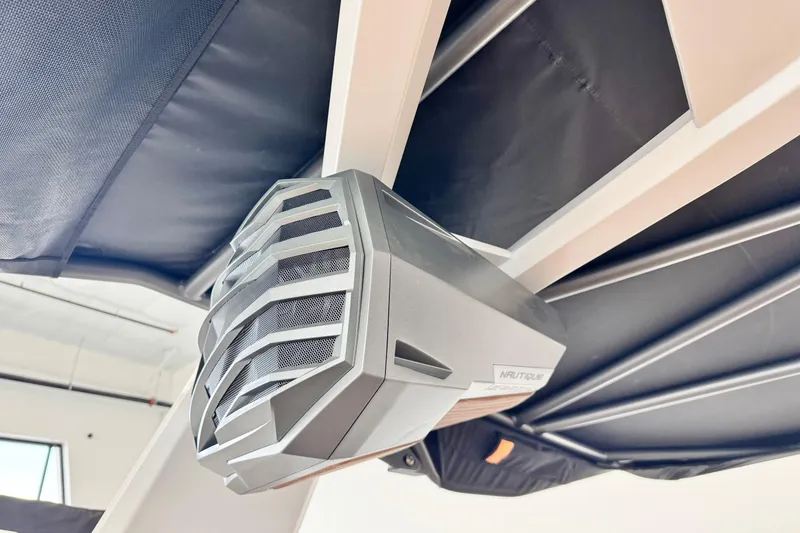 Slide: The Image of 2026 Nautique Super Air Nautique G23 boat speaker, sleek design, mounted under canopy. - 10
