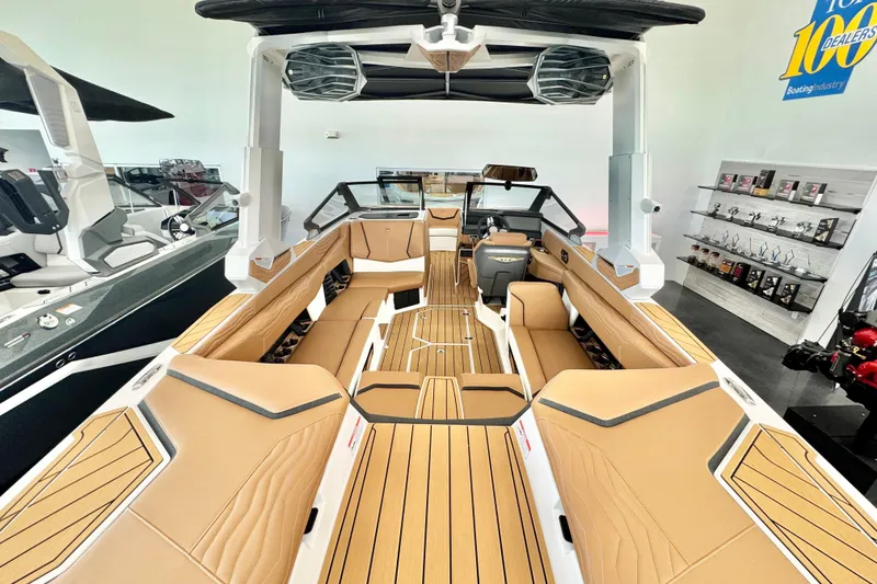 Slide: The Image of 2026 Nautique Super Air Nautique G23 boat interior with tan seating and modern design. - 6