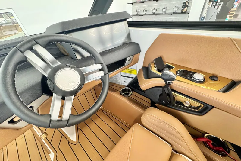 Slide: The Image of 2026 Nautique Super Air Nautique G23 cockpit with modern steering and controls. - 8