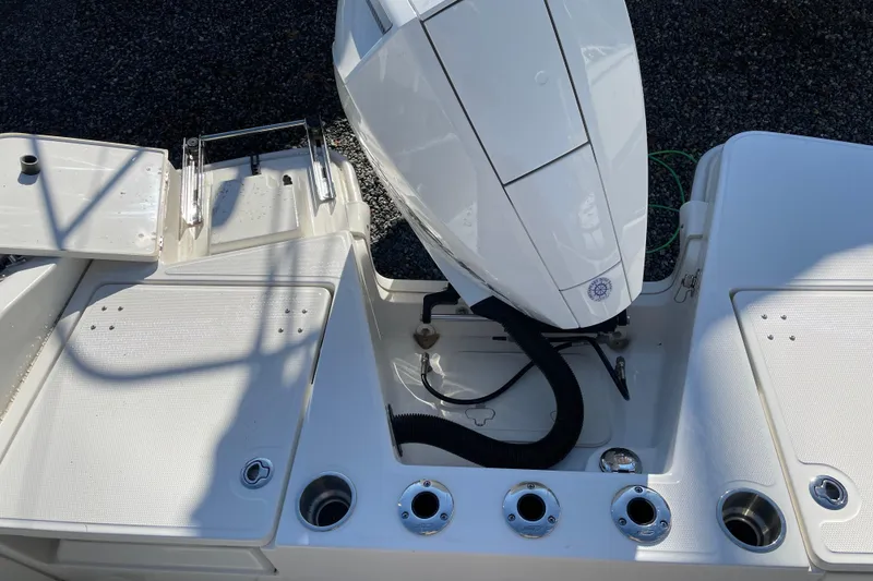 Slide: The Image of 2023 Boston Whaler 220 Dauntless boat engine and deck view. - 13