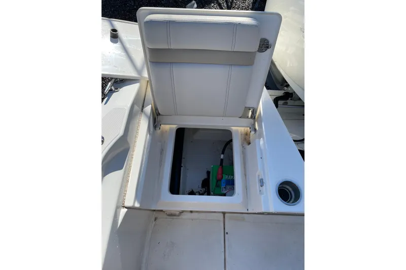 Slide: The Image of 2023 Boston Whaler 220 Dauntless boat storage compartment with open seat lid. - 18