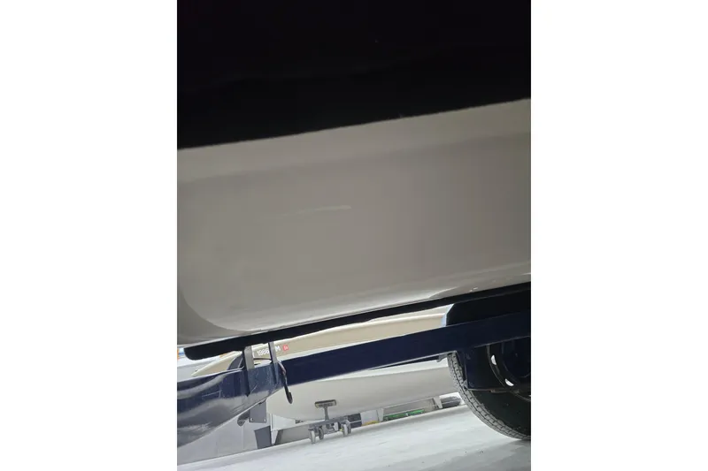 Slide: The Image of 2004 Larson LXi 190 boat underside view with trailer. - 35