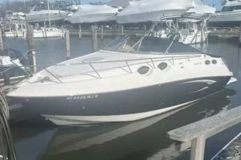 Slide: The Image of 2013 Glastron GS 289 boat docked in a marina, featuring sleek design and modern amenities. - 1