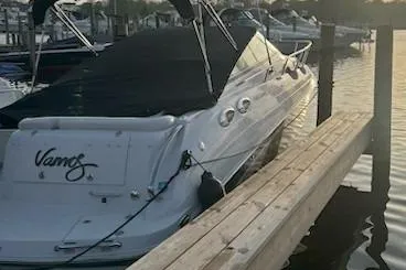 Slide: The Image of 2013 Glastron GS 289 boat docked at sunset, covered and secured. - 2