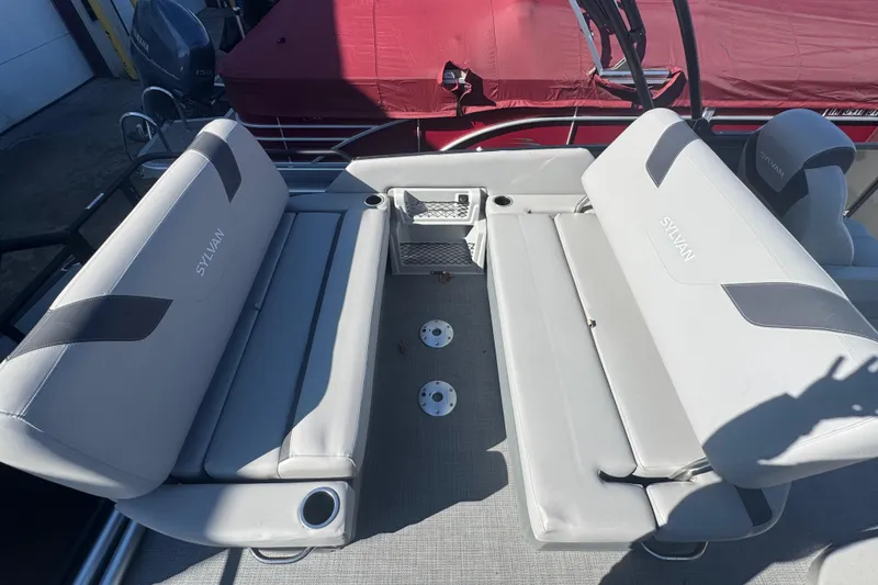 Slide: The Image of 2025 Sylvan L3 DLZ boat interior with gray seating and cup holders. - 10