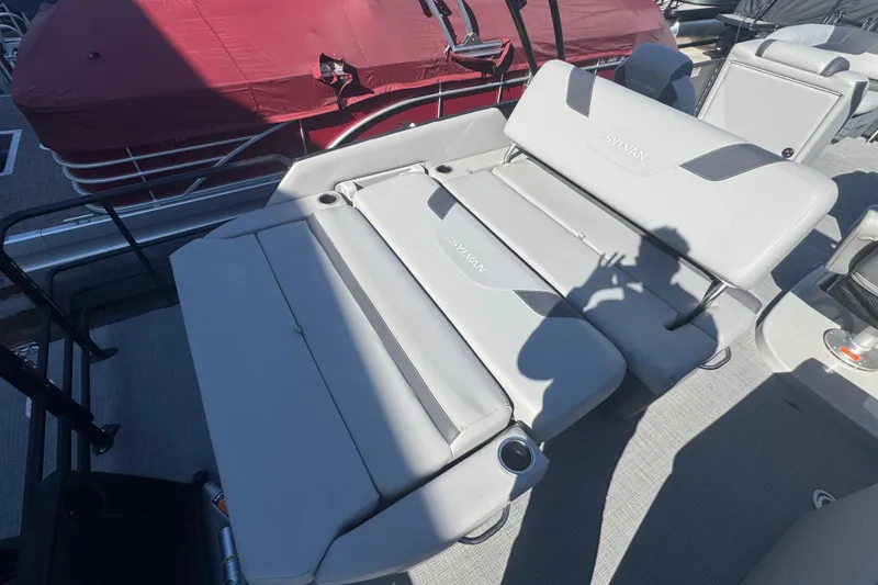 Slide: The Image of 2025 Sylvan L3 DLZ boat with luxurious gray seating and cup holders. - 11