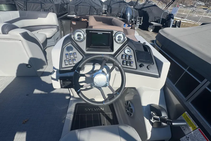 Slide: The Image of 2025 Sylvan L3 DLZ boat dashboard with steering wheel and control panel. - 8