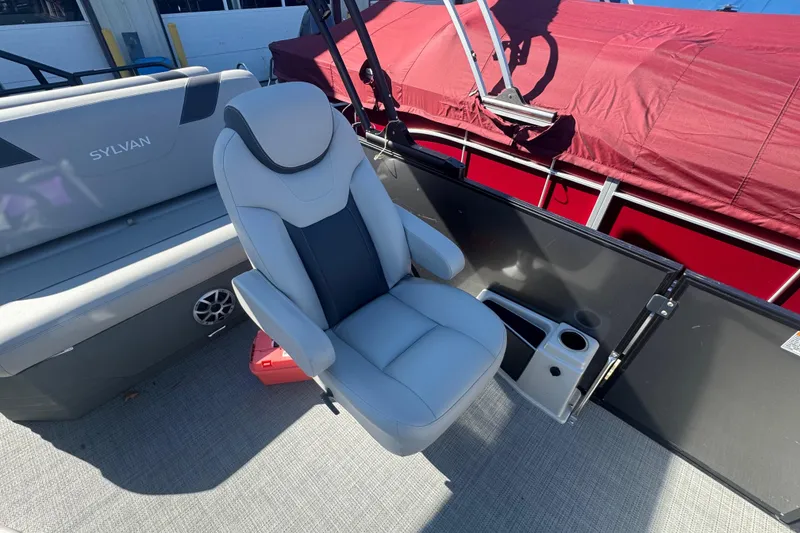 Slide: The Image of 2025 Sylvan L3 DLZ boat interior with comfortable seating and cup holders. - 9