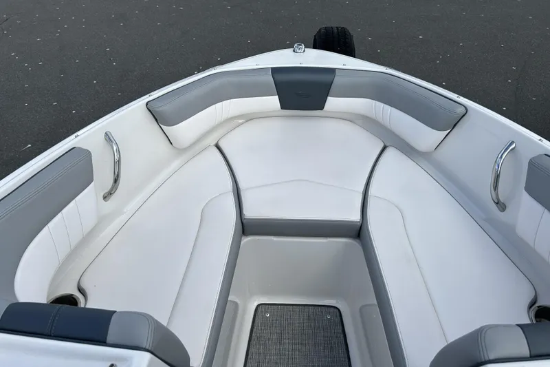 Slide: The Image of 2021 Chaparral 19 SSi boat interior with white and gray seating. - 10