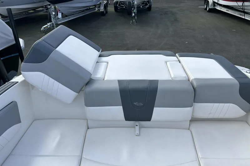 Slide: The Image of 2021 Chaparral 19 SSi boat interior with gray and white seating. - 20