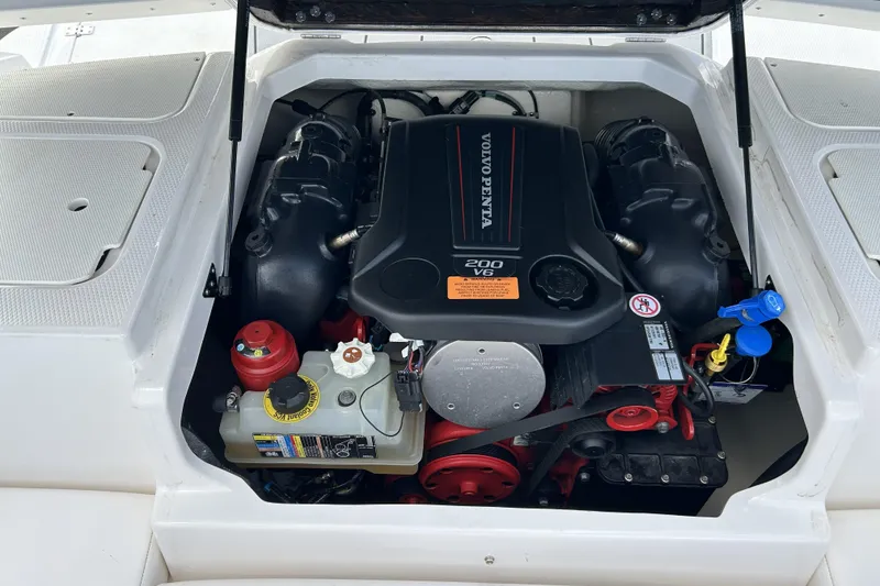 Slide: The Image of 2021 Chaparral 19 SSi boat engine compartment with Volvo Penta 200 V6 engine. - 21