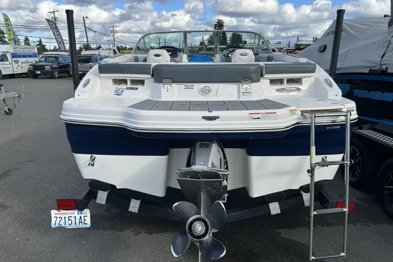 Slide: The Image of 2021 Chaparral 19 SSi boat rear view with outboard motor and ladder. - 5