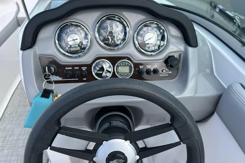 Slide: The Image of Dashboard of 2021 Chaparral 19 SSi boat with steering wheel and gauges. - 6