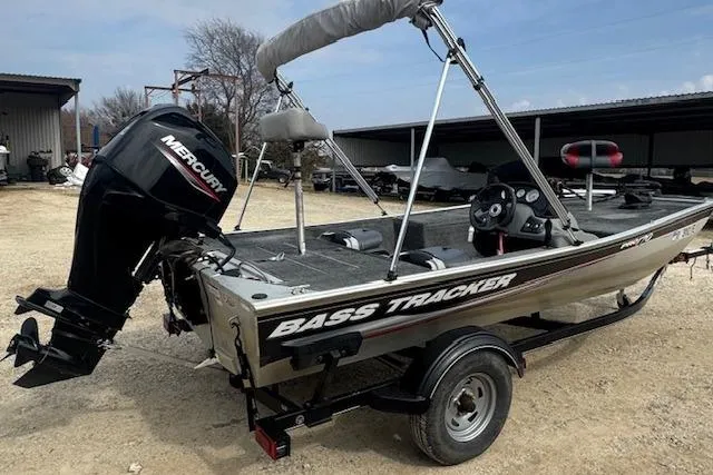 Slide: The Image of 2015 Tracker Pro 170 boat with Mercury engine, parked outdoors on a trailer. - 10