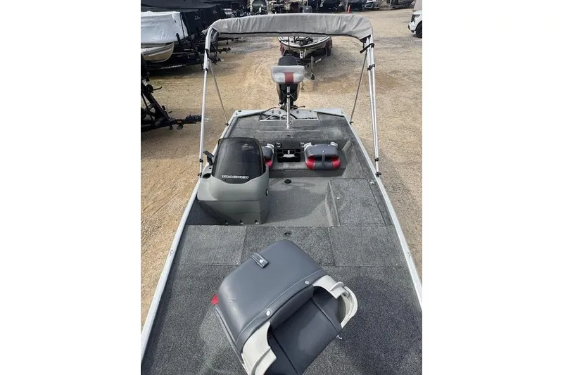 Slide: The Image of 2015 Tracker Pro 170 boat with seating and motor, parked on gravel. - 13