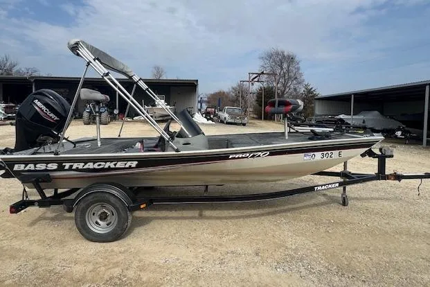 Slide: The Image of 2015 Tracker Pro 170 bass boat on trailer, parked outdoors. - 8