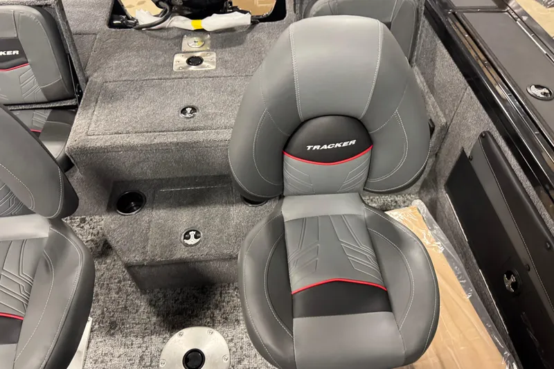 Slide: The Image of 2026 Tracker Targa V-19 Combo boat interior with gray and black seating. - 12