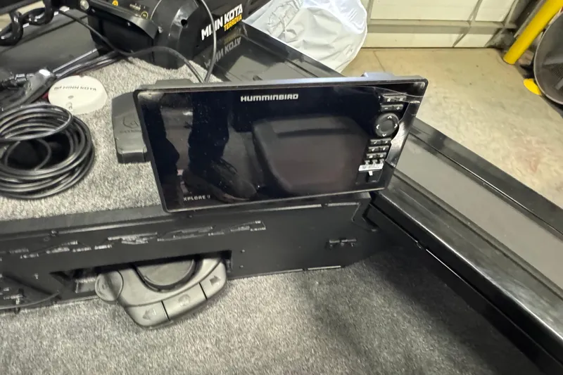 Slide: The Image of 2026 Tracker Targa V-19 Combo boat with Humminbird fish finder and Minn Kota trolling motor. - 19