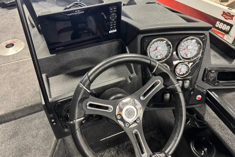 Slide: The Image of Steering console of 2026 Tracker Targa V-19 Combo with gauges and navigation display. - 6